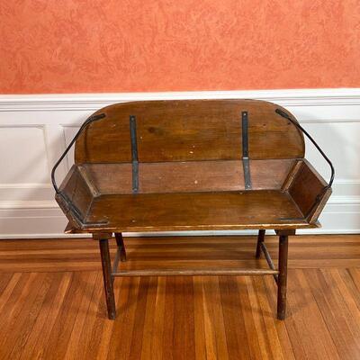 SMALL ANTIQUE SLED BENCH | With iron arm rests and hardware; h. 29-3/4 x w. 38 x d. 19 in.