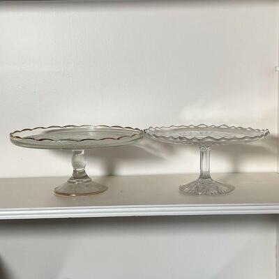 (2pc) CAKE STANDS | Pressed glass including one with harp motif and gilt rim; largest h. 4-3/4 x dia. 10 in.