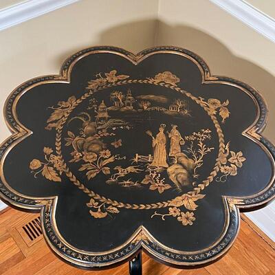 LACQUERED SIDE TABLE | Chinese or Japanese black lacquered table with gilt painted decoration with a scene of figures and a dog in a...