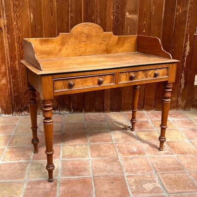 ANTIQUE WASH STAND | With 3/4 gallery top over two drawers over turned tapering legs; h. 39-3/4 x w. 42 x d. 20 in.