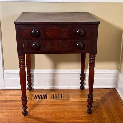 ANTIQUE TWO DRAWER STAND | With two drawers over turned legs; h. 28-1/4 x w. 22 x d. 18-1/2 in.