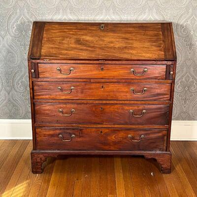 ANTIQUE SLANT LID DESK | Drop front reveals a fitted interior over four full width drawers [escutcheon detached but present]; h. 42-1/4 x...