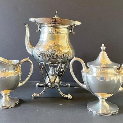 Silver plate tea kettle. Sterling cream and sugar.