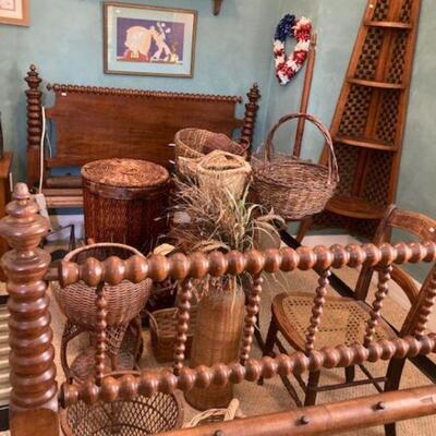 Wicker baskets and vintage bedframe