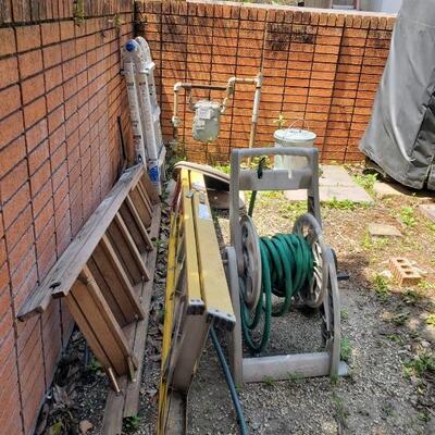 Extension ladder, wooden ladder, hose on reel
