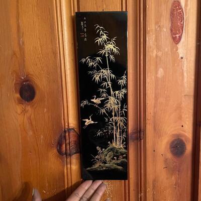 Pair of lacquered wall hangings 