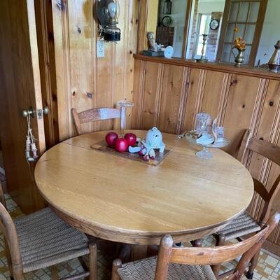 Round oak kitchen or dining room table with  rush seat chairs