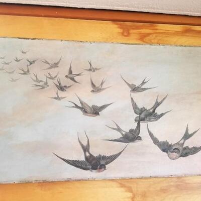 Painted panel of swallows in flight