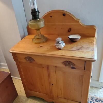 Stripped pine washstand with foliate pulls