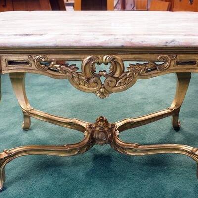 1078	ORNATE ITALIAN CARVED GILT WOOD TABLE WITH ROSE MARBLE TOP. APPROXIMATELY 35 IN X 23 IN X 22 IN HIGH
