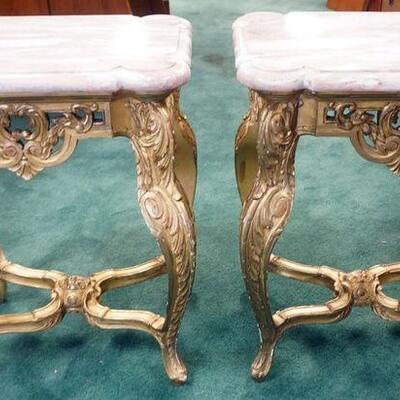 1079	PAIR OF ORNATE ITALIAN CARVED GILT WOOD TABLES WITH ROSE MARBLE TOP. APPROXIMATELY 20 IN X 16 IN X 26 IN HIGH
