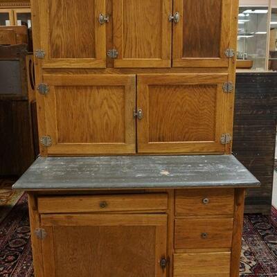 1055	GLOBE WERNICKE 4 SECTION OAK STEP BACK BARRISTER BOOKCASE. MISSING BASE, APPROXIMATELY 34 IN X 14 IN X 59 IN HIGH
