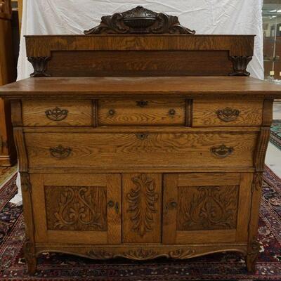 1057	OAK ICE BOX WITH PRESSED CARVED FRONT, *THE GEM*. APPROXIMATELY 29 IN X 19 IN X 42 IN HIGH
