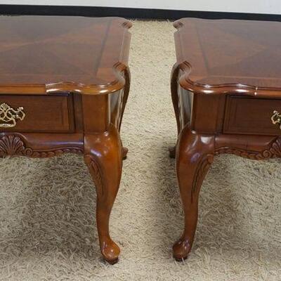 1073	PAIR OF MAHOGANY SCALLOPED EDGE, 1 DRAWER END TABLES. APPROXIMATELY 23 IN X 27 IN X 24 IN HIGH
