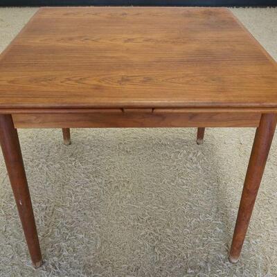 1087	DANISH TEAK WOOD TABLE WITH EXTENDING LEAVES. APPROXIMATELY OPEN 64 IN, CLOSED 34 IN X 50 X 29 IN HIGH
