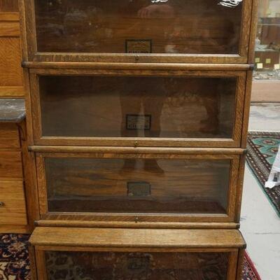 1056	OAK CARVED 4 DRAWER, 2 DOOR SERVER. APPROXIMATELY 50 IN X 24 IN X 52 1/2 IN HIGH
