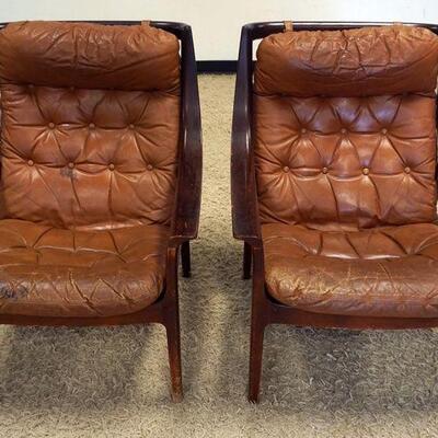 1080	PAIR OF MID CENTURY MODERN ARM CHAIRS, MARKED SUN EXPO LTD A.S., MADE IN NORWAY. LEATHER WORN
