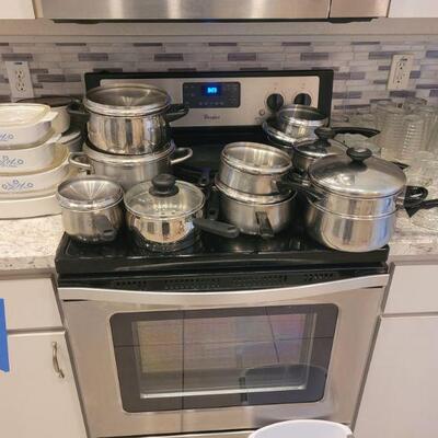 lots of pots and pans and corning ware