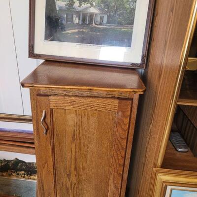 small oak cabinet and a photo of Roosevelts Little White Farmhouse