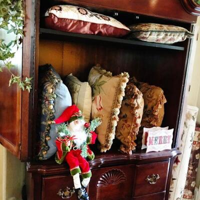 Armoire full of Needlepoint pillows