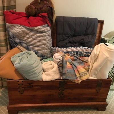 Cedar chest full of blankets, throws, etc.