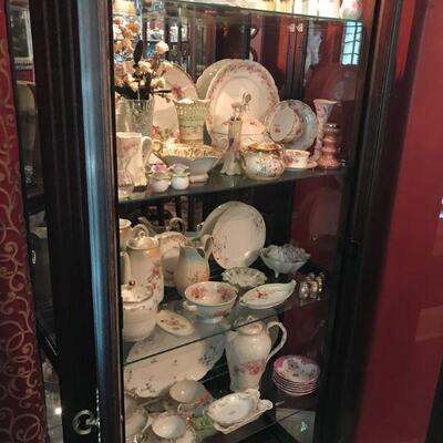 Tall Mahogany Curio Cabinet full of Elegant Pieces