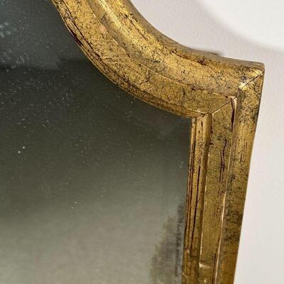 GILT BEVELED MIRROR | Beveled glass mirror in a fancy gilt frame; h. 47 x 20-1/2 in.