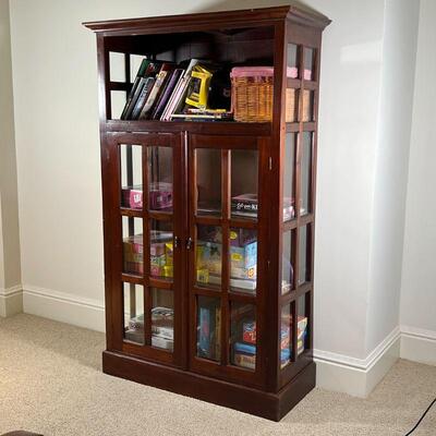 BOOKCASE CABINET | Ethan Allen style with an open shelf over glazed double cabinet doors; h. 70-1/2 x w. 43 x d. 18-1/2 in.