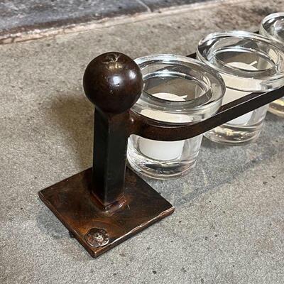 JAN BARBOGLIO VOTIVE HOLDER | Wrought iron frame suspending glass candle holders; h. 5 x w. 41 in.