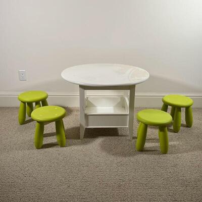 (5pc) KIDS TABLE & CHAIRS | Including a Land of Nod white bin table and four green plastic stools; table h. 23 x dia. 32 in.