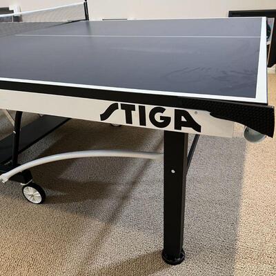 STIGA PING PONG TABLE | Model T8742, with four paddles, in excellent condition; h. 29-1/2 x w. 60-1/2 x l. 110 in.