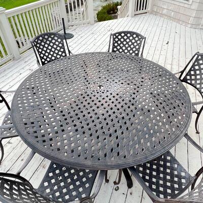 ALUMINUM PATIO SUITE | Outdoor patio dining set, comprising a large round table and six armchairs; table h. 28-1/2 x dia. 70 in., chair...