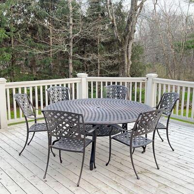 ALUMINUM PATIO SUITE | Outdoor patio dining set, comprising a large round table and six armchairs; table h. 28-1/2 x dia. 70 in., chair...