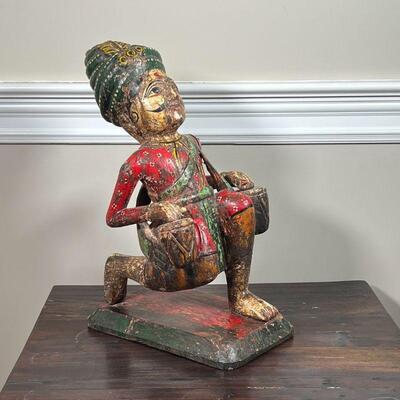INDO-CHINESE CARVING | Polychromed and carved wood figure with drums; h. 19 x 10 x 12 in.