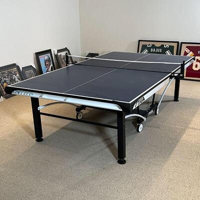 STIGA PING PONG TABLE | Model T8742, with four paddles, in excellent condition; h. 29-1/2 x w. 60-1/2 x l. 110 in.