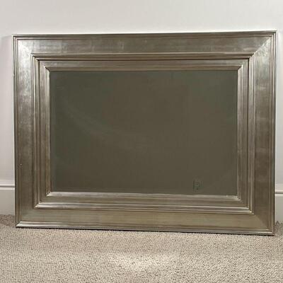 BEVELED OVER MANTEL MIRROR | Beveled glass mirror in a broad silvered frame; h. 35-1/2 x w. 48 in.