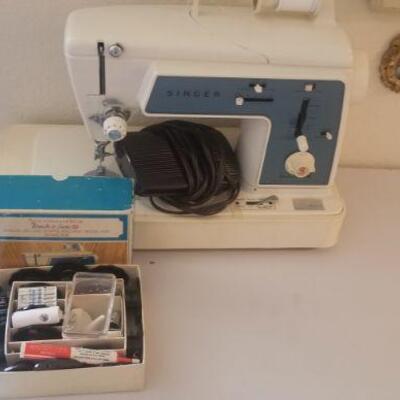 singer sewing  machine.$35 with attachments