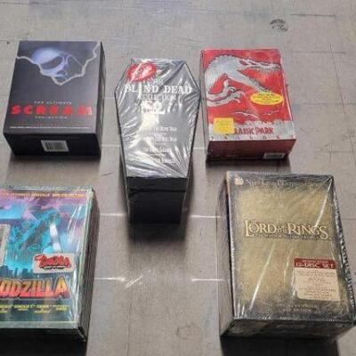 #4516 â€¢ Box DVD Sets Includes Godzilla, Scream, Lord Of The Rings, And More. 