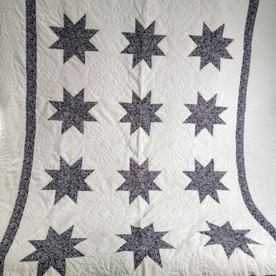 cream and black quilt