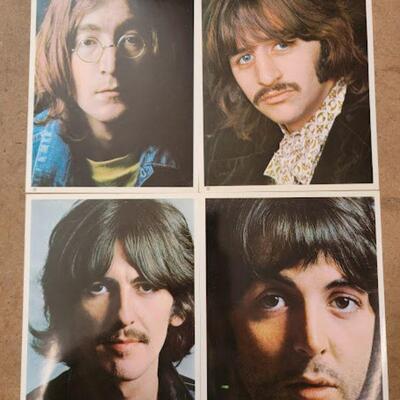 white album with photos and poster