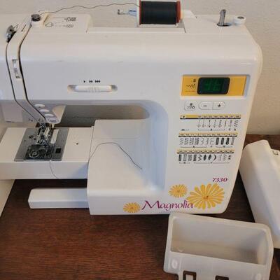 This one is a Janome sewing machine with case