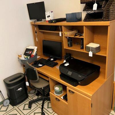 Office items monitor printers and desk  