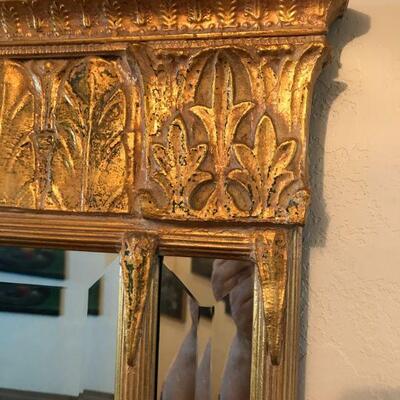 Gold plaster beveled glass mirror in the Trumeau or Deco style, measures approx. 32” high x 26” wide