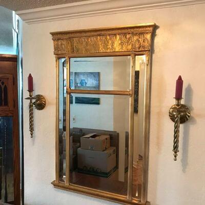 Gold plaster beveled glass mirror in the Trumeau or Deco style, measures approx. 32” high x 26” wide