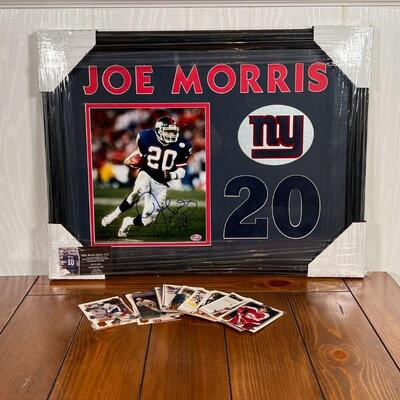 JOE MORRIS SIGNATURE | Framed autographed photograph of NY Giants Joe Morris; plus hockey player collector's cards; overall 16 x 21-1/4 in.