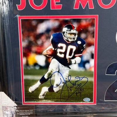 JOE MORRIS SIGNATURE | Framed autographed photograph of NY Giants Joe Morris; plus hockey player collector's cards; overall 16 x 21-1/4 in.