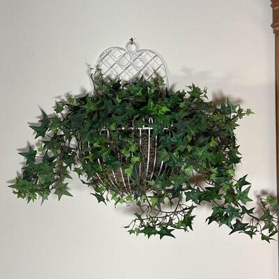 FAUX IVY WALL PLANTER | Faux ivy in a white wire wall hanging planter; 16 x 24 in. 