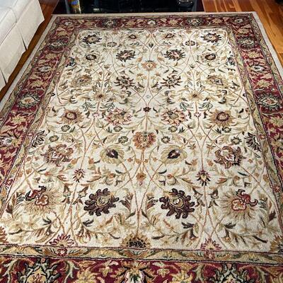 FLORAL AREA RUG | Floral design over tan field with red flower bud border; 10 ft. 10 in. x 7 ft. 10 in.