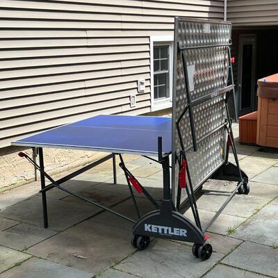 OUTDOOR PING PONG TABLE | Made by Kettler, comes with paddles and weather resistant cover, on four wheels, folds for easy storage; folded...