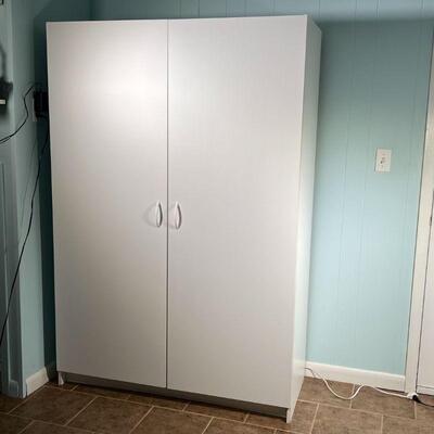 WHITE STORAGE CABINET | Wide double door pantry / cabinet, with shelves and hanging space; h. 71-1/2 x w. 48 x d. 20-1/2 in.